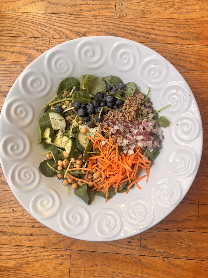 Salad mixed together included onion, blueberries, chickpeas.